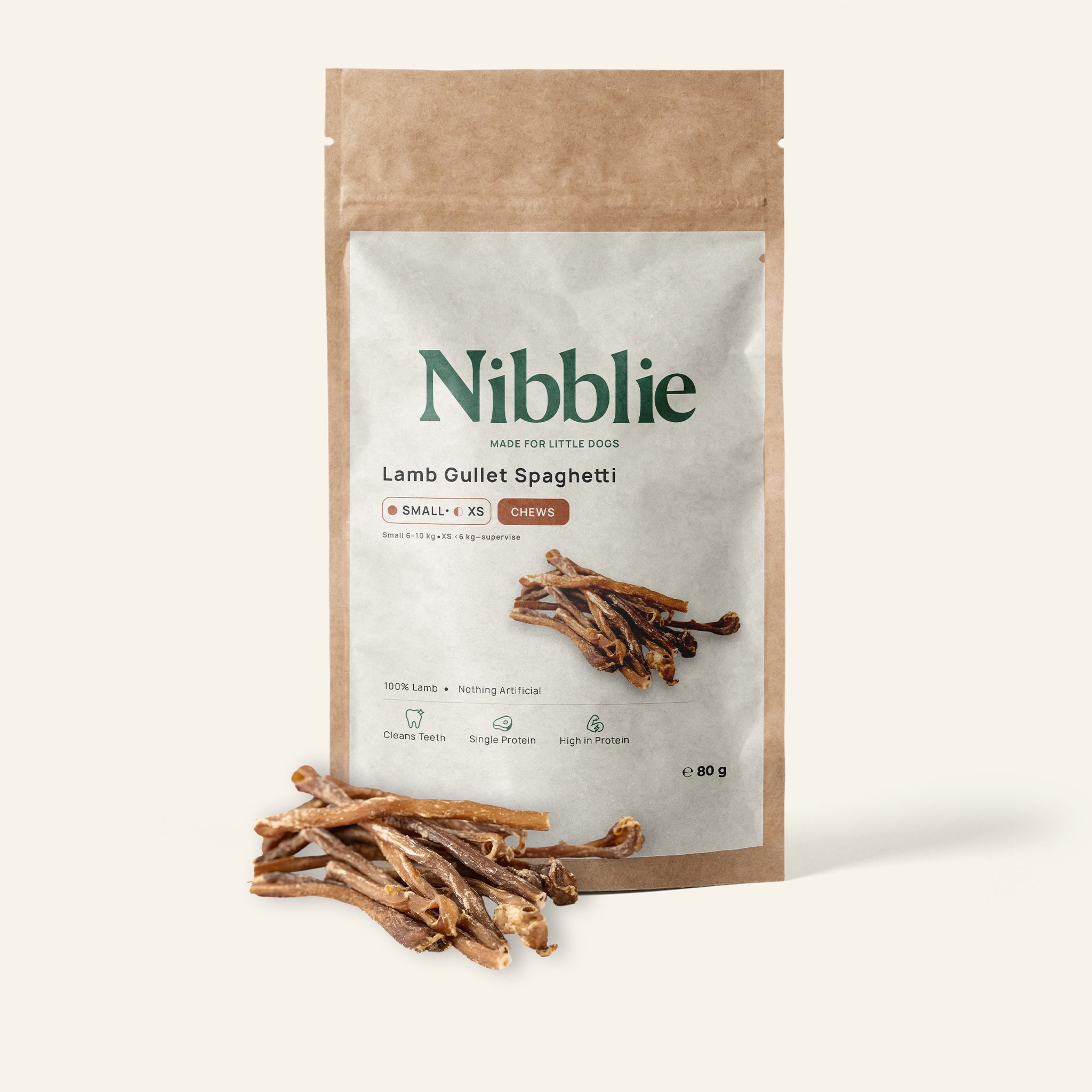 Nibblie Lamb Spaghetti 80g pack on warm linen with strands in front; lamb gullet chew for small dogs.