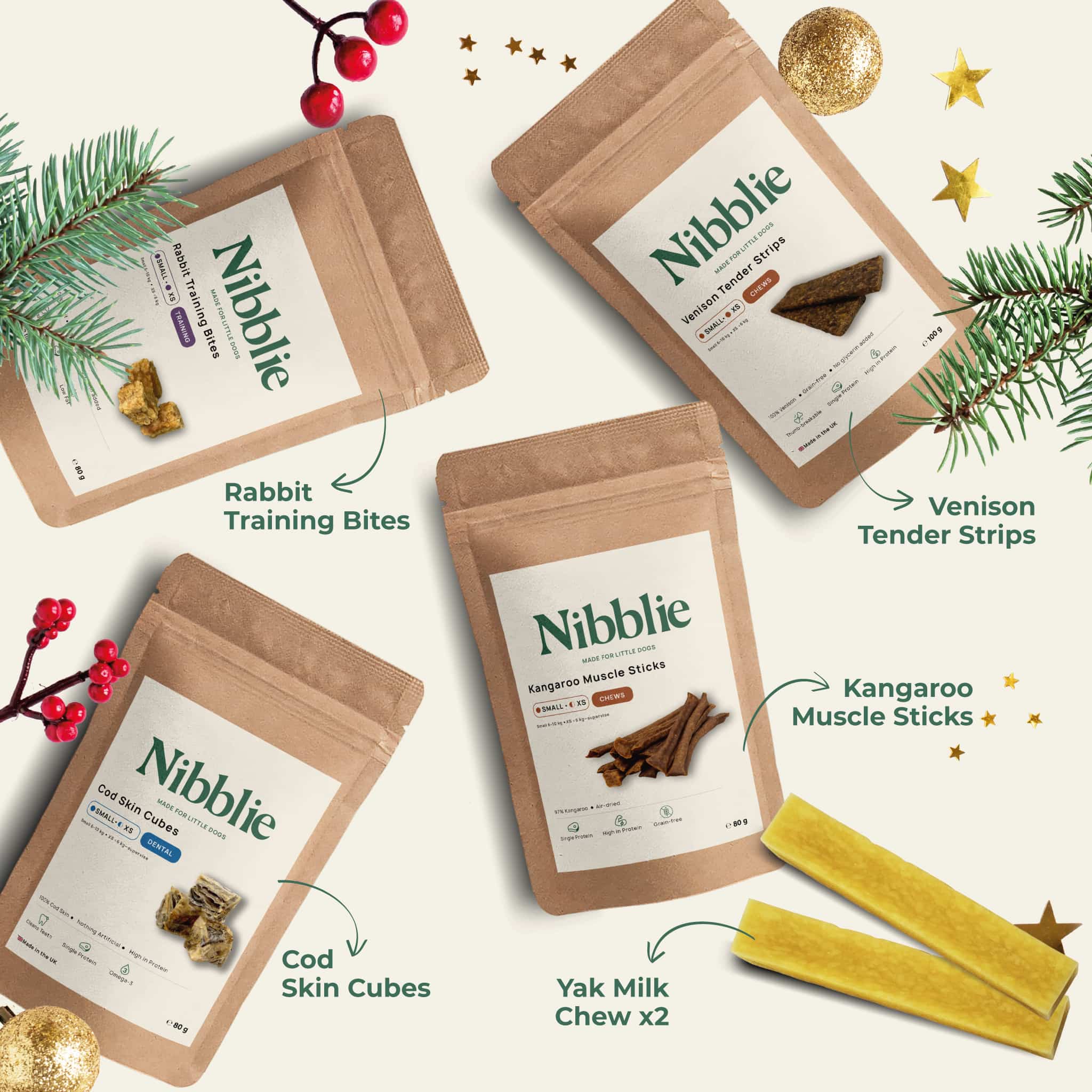 Flat lay of the Nibblie Christmas Pack showing rabbit bites, cod skin cubes, kangaroo sticks, venison strips and yak milk chews for small dogs