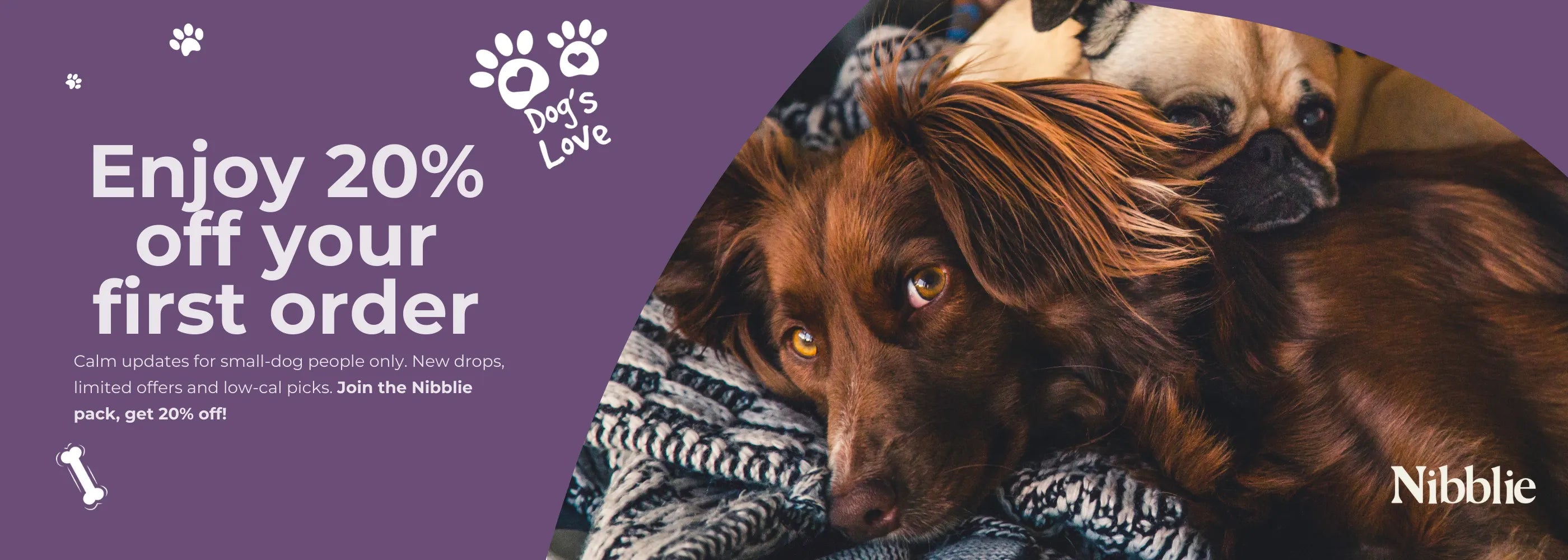 Promotional banner for Nibblic with two dogs and a discount offer on a purple background.
